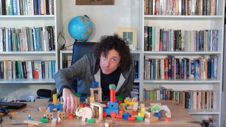 Jeffrey Baumgartner building an idea with building blocks