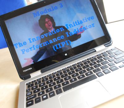 Laptop showing video for Innovation Manager training